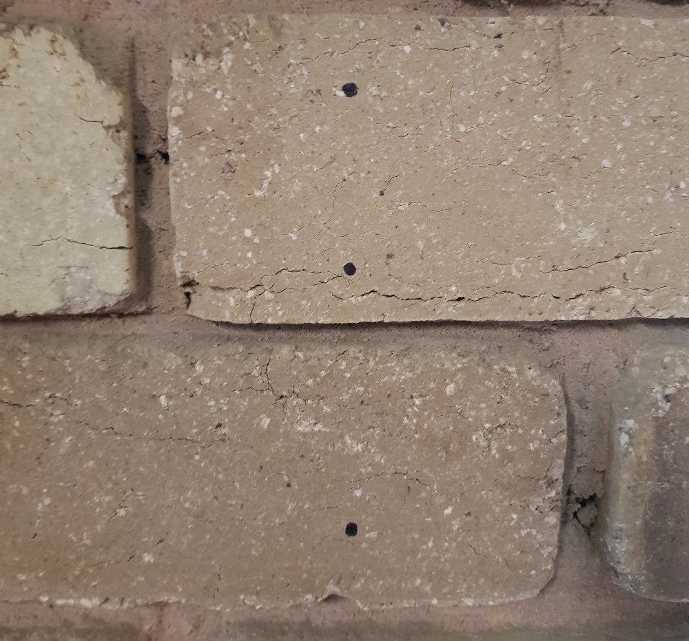 Brick wall sharpie marks